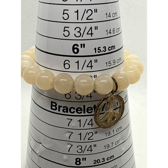 Beaded Stretch Bracelet With Gold Peace Charm - Picture 2 of 4